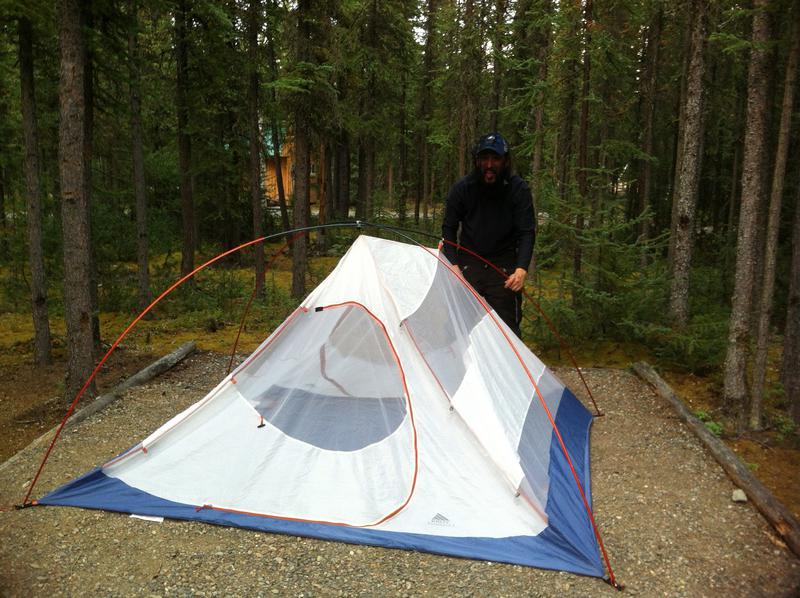 Gregg Wearing a Mosquito Net Setting Up The Tent