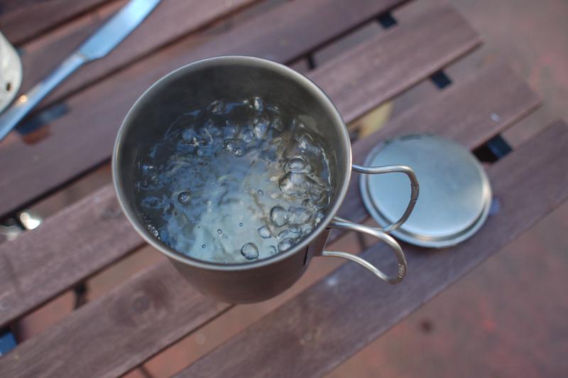 Boiling water from alcohol stove.